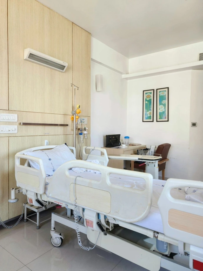 Hospital room with two beds and furniture